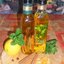 Купажное оливковое масло с лимоном, апельсином и корицей и лимонное с мятой