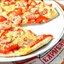 Пицца по‑итальянски с помидорами черри и двумя видами сыра